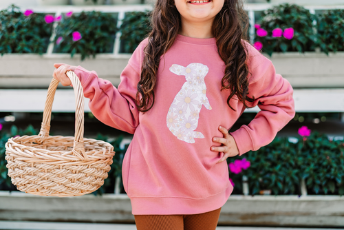 Youth girl wearing a pink Easter bunny sweatshirt, spring photo outfit idea for kids