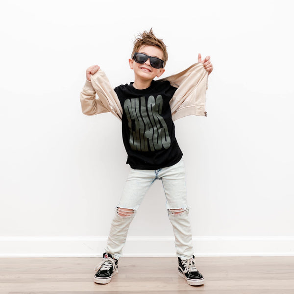 Toddler boy wearing Chaos graphic tee trendy street style outfit